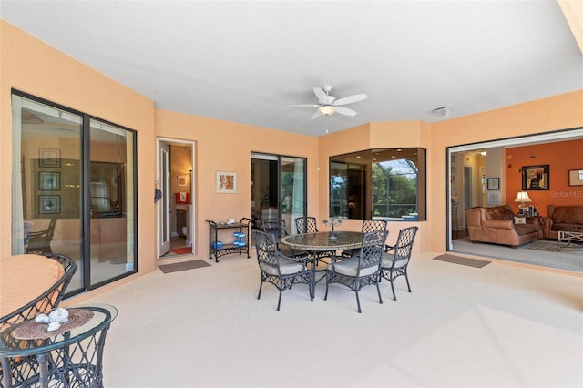 dining space with ceiling fan