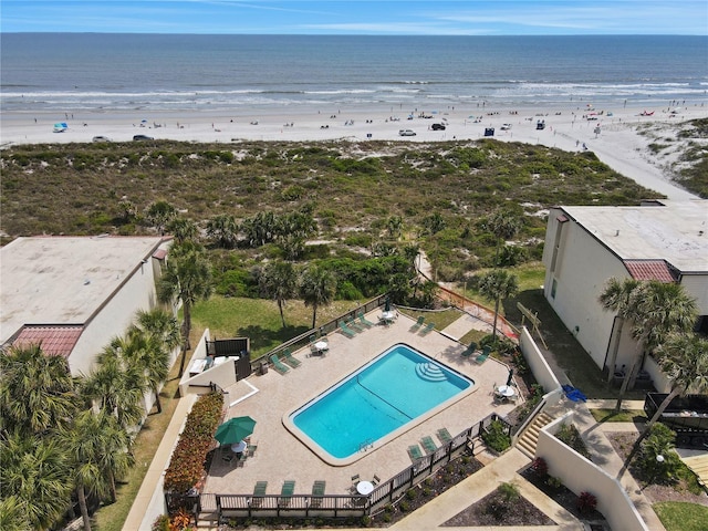 birds eye view of property featuring a water view and a view of the beach