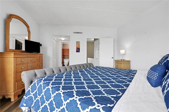 bedroom with wood-type flooring