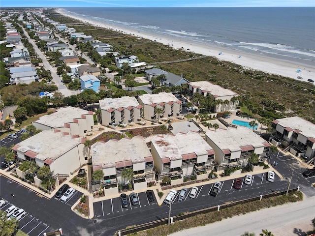 aerial view with a water view and a view of the beach