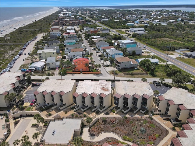 birds eye view of property featuring a water view and a view of the beach