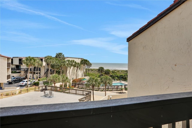 exterior space with a water view and a view of the beach