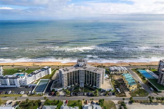 drone / aerial view with a view of the beach and a water view