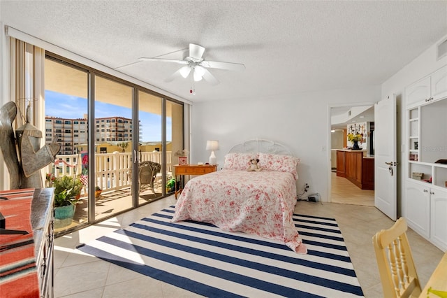 bedroom with access to exterior, ceiling fan, light tile floors, and a textured ceiling