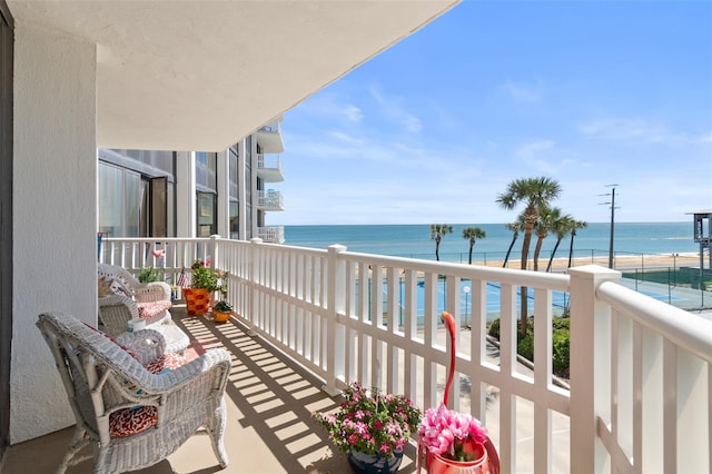 balcony featuring a water view