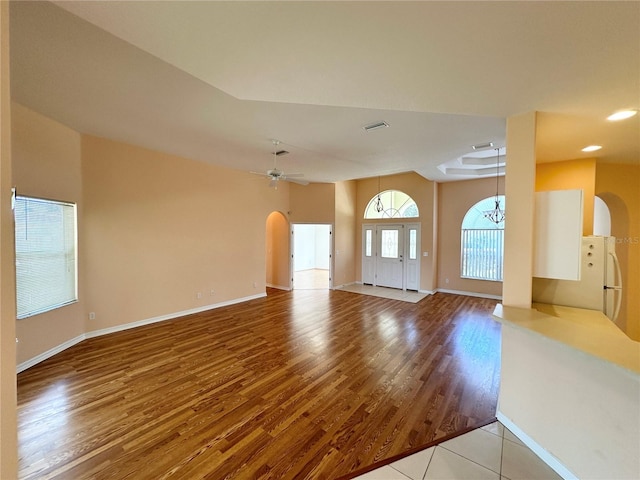 empty room with light hardwood / wood-style floors and ceiling fan