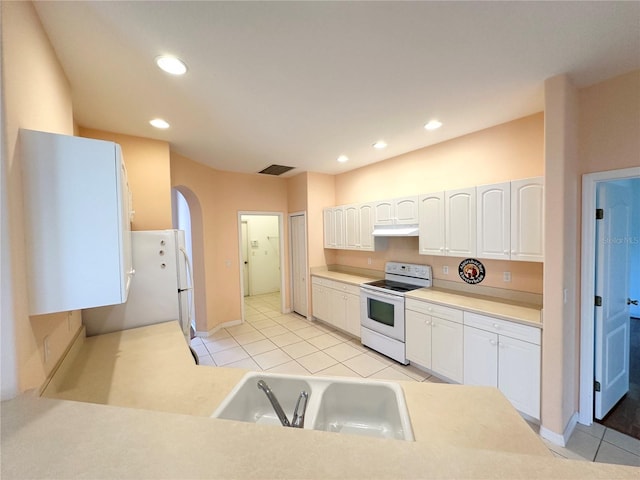 kitchen featuring sink, white appliances, white cabinetry, and light tile floors