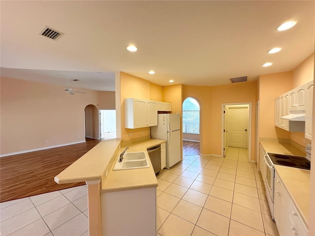 kitchen with white appliances, ceiling fan, light tile floors, and sink