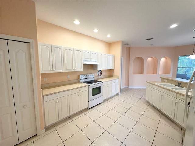 kitchen with white electric range oven, decorative light fixtures, light tile flooring, white cabinets, and sink