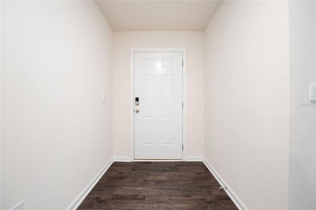 entryway with dark wood-type flooring