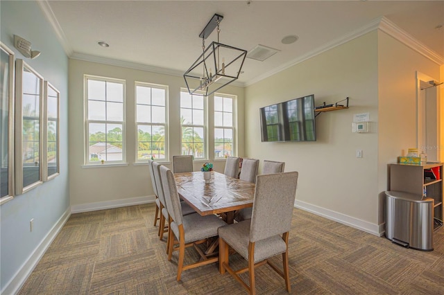 dining area with a chandelier and ornamental molding