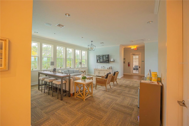 dining space with dark carpet, ornamental molding, and french doors