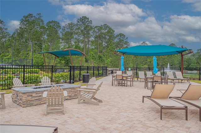 view of patio / terrace featuring an outdoor fire pit