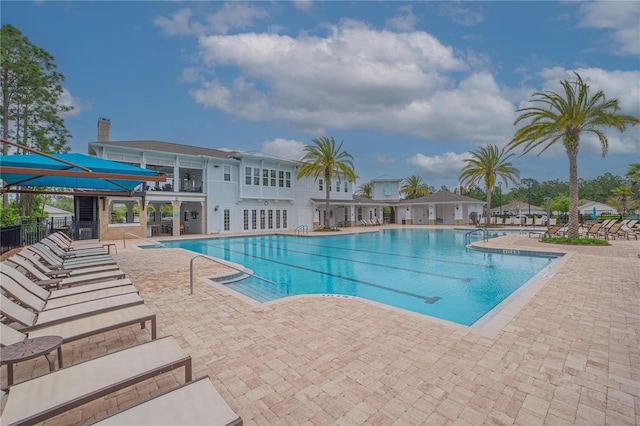 view of swimming pool featuring a patio area