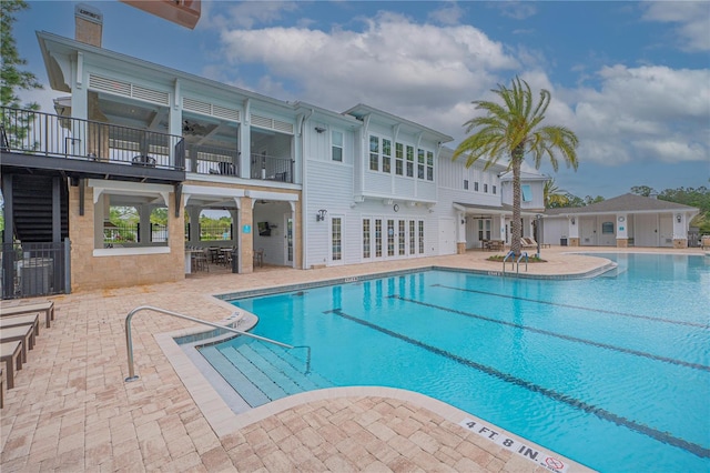 view of swimming pool with a patio