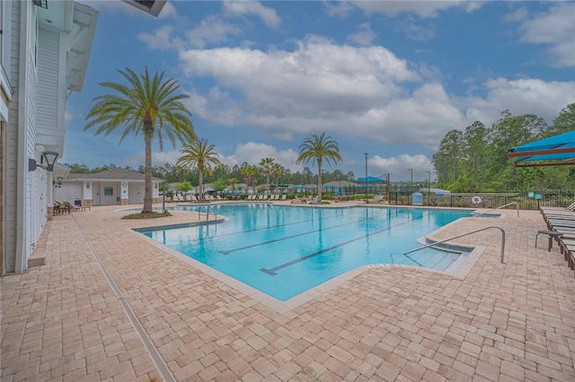 view of swimming pool with a patio area