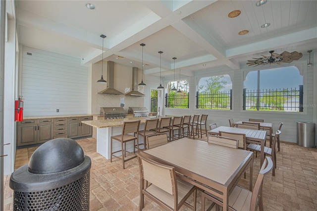 dining room with coffered ceiling and beam ceiling