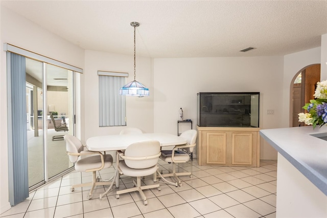 dining area with light tile floors