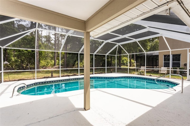 view of swimming pool featuring a lanai and a patio area