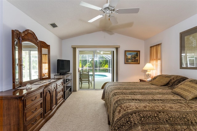 carpeted bedroom featuring multiple windows, access to exterior, ceiling fan, and vaulted ceiling