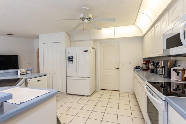 kitchen with ceiling fan, white appliances, light tile floors, a textured ceiling, and white cabinets