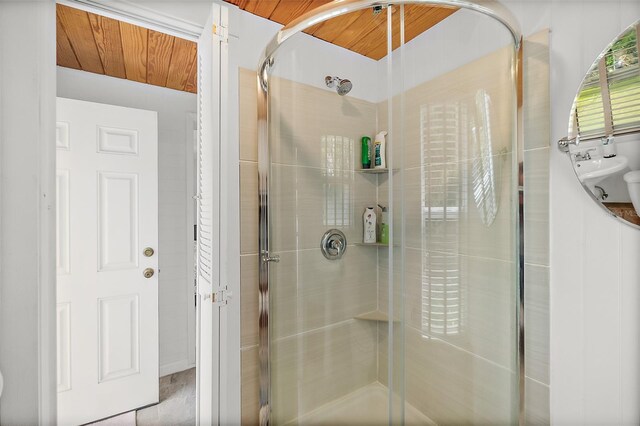 bathroom featuring walk in shower and wooden ceiling