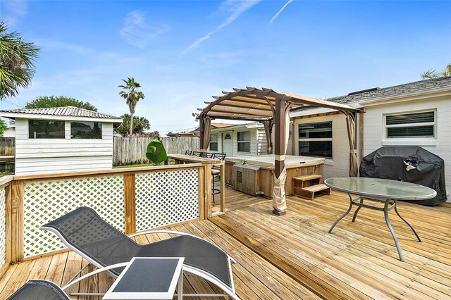 wooden deck with a gazebo and a hot tub