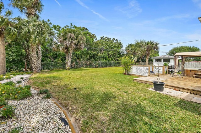 view of yard with a deck