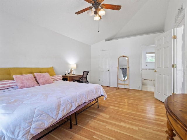 bedroom featuring ceiling fan, lofted ceiling, and light wood-type flooring