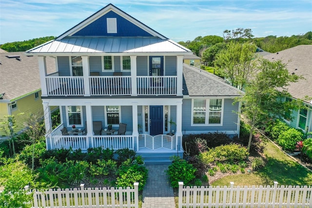 view of front of home featuring a balcony and covered porch