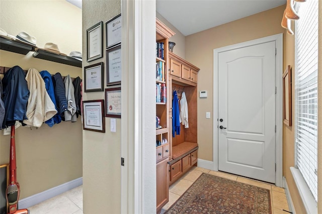 mudroom with light tile floors