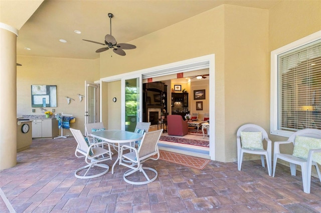 view of terrace featuring ceiling fan