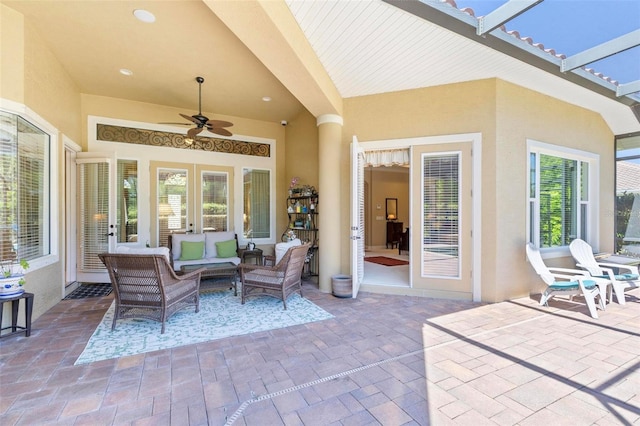 view of patio featuring an outdoor living space and ceiling fan