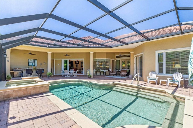 view of pool featuring a patio, ceiling fan, and a lanai