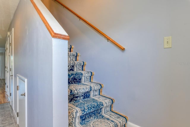 stairs with light tile floors