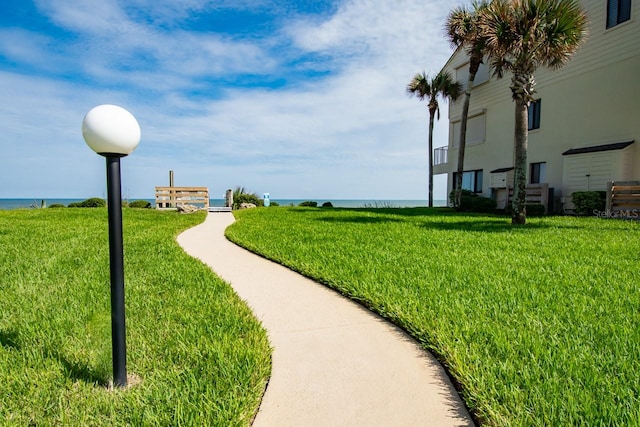 view of nearby features featuring a yard and a water view