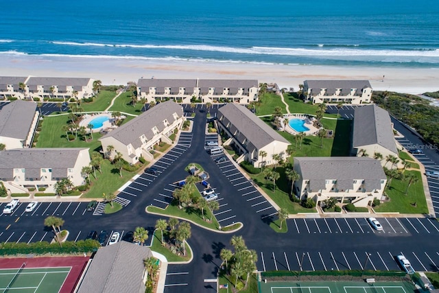 birds eye view of property featuring a water view and a view of the beach