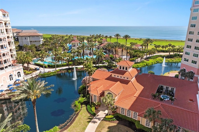 birds eye view of property with a water view