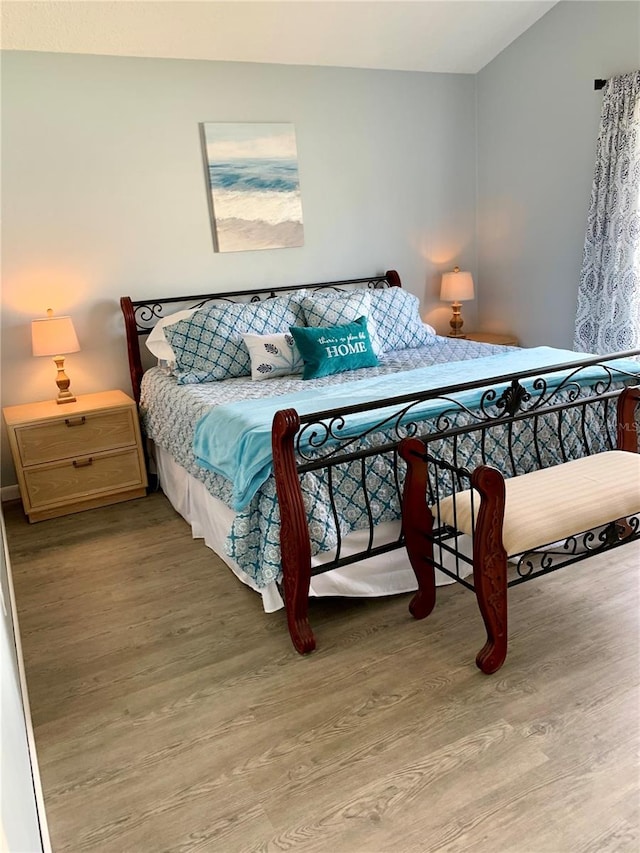 bedroom with wood-type flooring