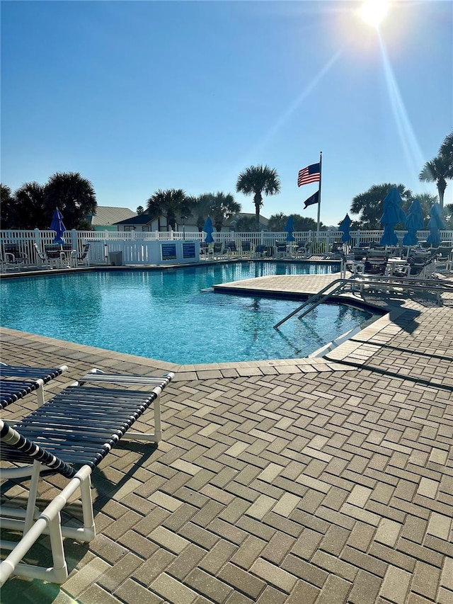 view of swimming pool with a patio