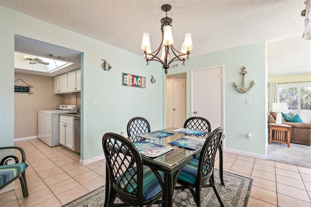 dining space featuring ceiling fan with notable chandelier, a textured ceiling, and light tile flooring