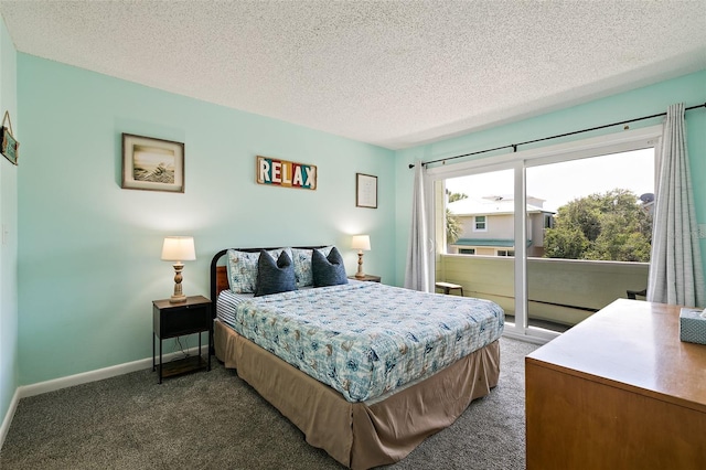 carpeted bedroom featuring a textured ceiling