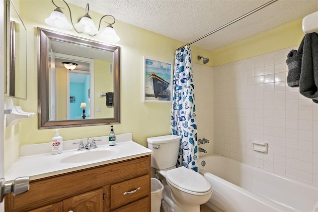 full bathroom featuring oversized vanity, shower / tub combo, toilet, and a textured ceiling