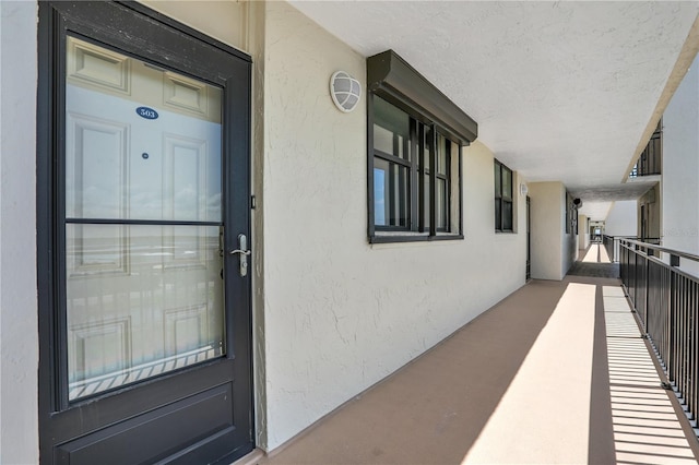 entrance to property featuring a balcony