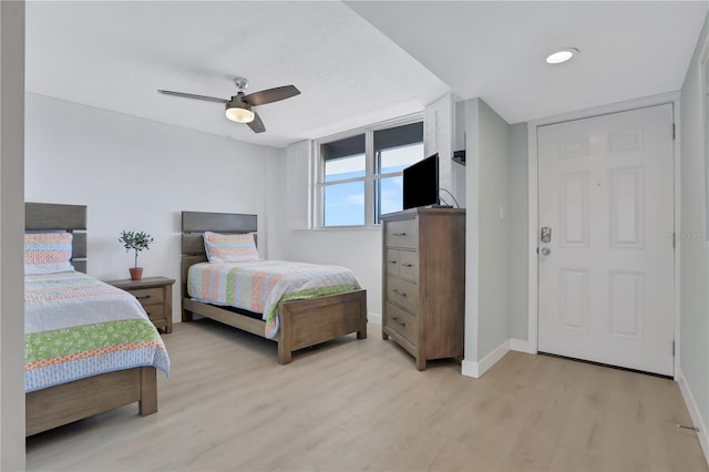 bedroom featuring ceiling fan and hardwood / wood-style flooring