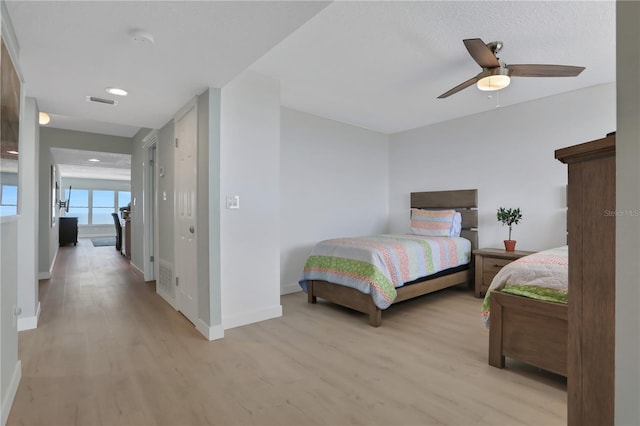 bedroom featuring wood-type flooring and ceiling fan