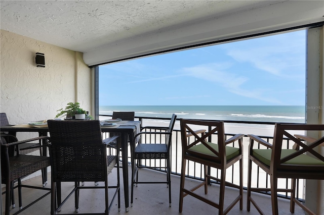 balcony featuring a water view