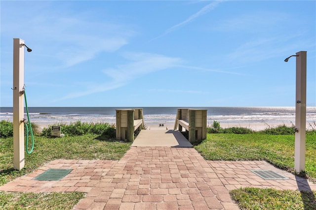 view of nearby features featuring a beach view and a water view