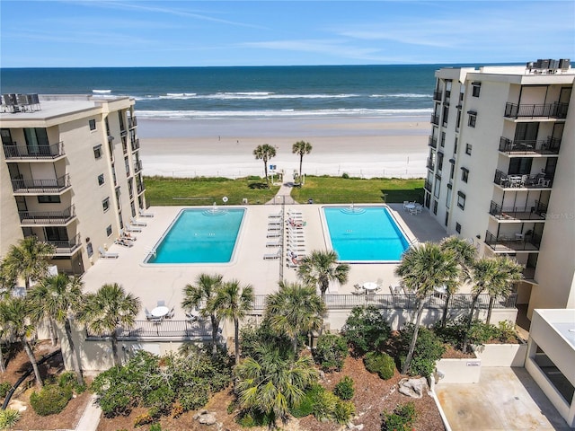 view of swimming pool with a water view