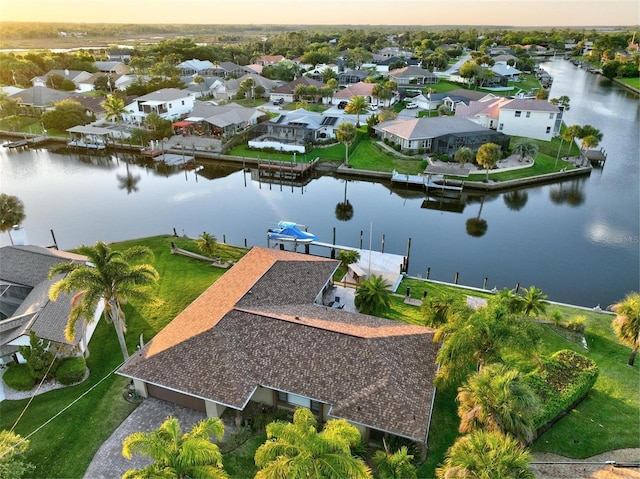 aerial view at dusk with a water view